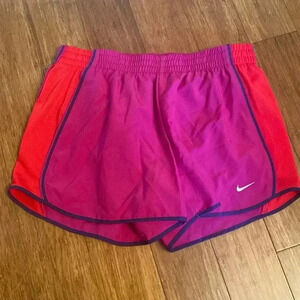 Nike Dri-fit women’s running shorts - magenta/red- inside pocket - medium